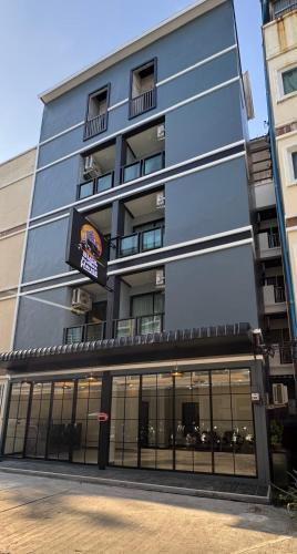 a large building with a lot of windows at Black Pantera House in Patong Beach