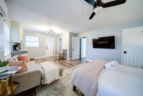 a bedroom with a bed and a ceiling fan at Stylish 4BR Home - Modern & Bright Interior in Charlotte