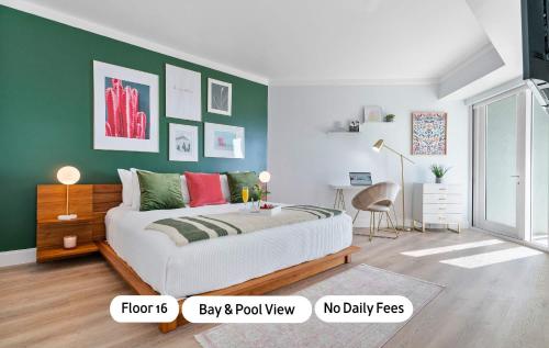 a bedroom with a bed and a green wall at MVR - Elevate Your Stay with Stunning Ocean Views in Miami
