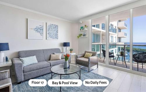a living room with a couch and a table at MVR - Sunsets So Good You-ll Book Twice in Miami