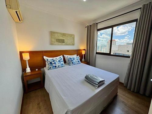 Giường trong phòng chung tại Flat 02 Quartos Long Stay Alvorada Vila Olímpia