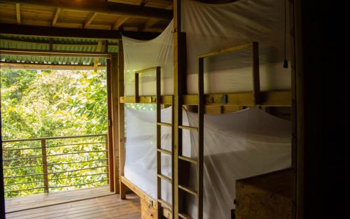 Postel nebo postele na pokoji v ubytování Mendihuaca Surf Camp