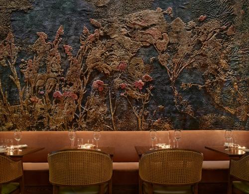 a wall mural in a restaurant with two tables at Sixty DC in Washington