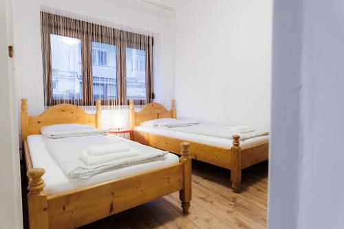 En eller flere senge i et værelse på Boho Apartment