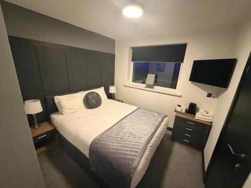 En eller flere senge i et værelse på Woodhouse Hotel Blackpool Promenade