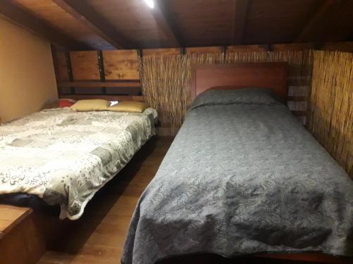 En eller flere senge i et værelse på Cà Dalilà relax natura e familia