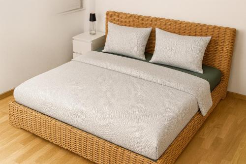 En eller flere senge i et værelse på FeWo-Gmunden - Traunsee Apartment 60 m2