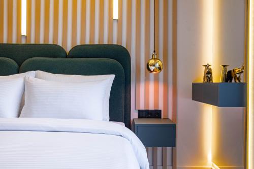 En eller flere senge i et værelse på New Gudauri Atrium Ski and Dream Apartments