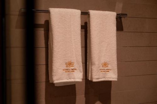 two towels hanging on a towel rack in a bathroom at Heaven's Dreams Business Bay in Dubai
