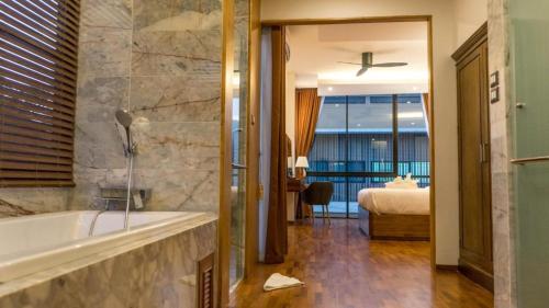 En eller flere senge i et værelse på Chic Villa 6