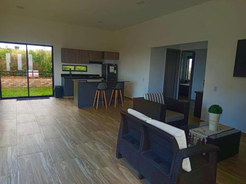 a living room with a couch and a table at LUZ DE LUNA mesa de los santos house in Los Santos