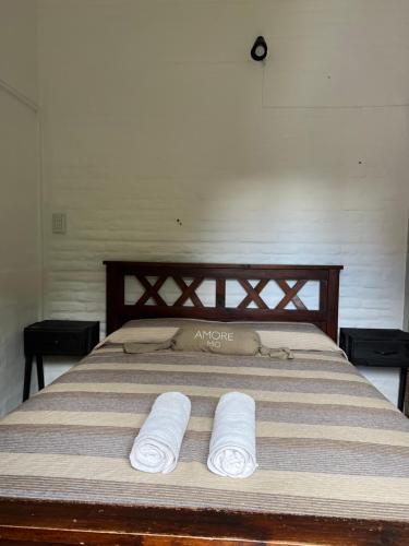 En eller flere senge i et værelse på Depto 168