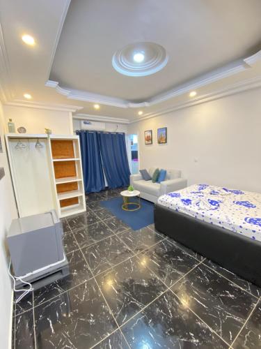 En eller flere senge i et værelse på Apartement Chaleureux et Prestigieux