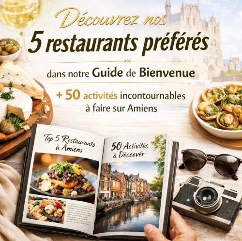 Eine Zeitschrift lag auf einem Tisch neben Essen und einer Kamera. in der Unterkunft WHITE PEARL Amiens Suite Luxe en Hyper Centre in Amiens