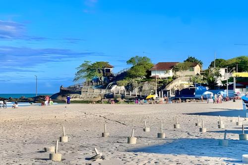a beach with a sand castle on the beach at Thebluee Matinhos beach in Matinhos