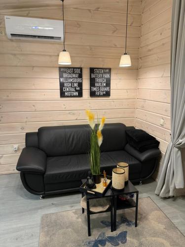 Et opholdsområde på Obuoliu Sala COZY HOUSE on the Apple Island