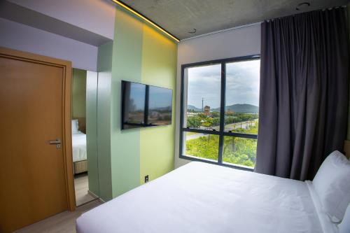 En eller flere senge i et værelse på Liwe Hotels