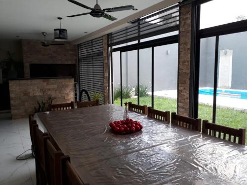 a dining room table with strawberries on top of it at CASA CON PILETA EN EL CENTRO de CORRIENTES in Corrientes