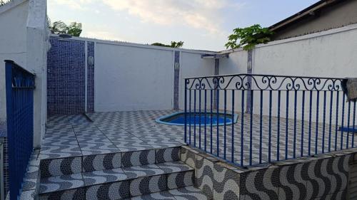 a wrought iron fence with a blue frisbee at Praias da Amazônia in Belém