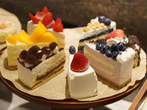 a plate with several different types of desserts at Mercure Xi'an Stadium Hotel in Xi'an