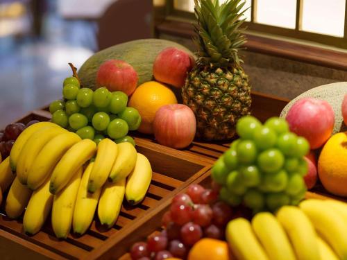 a display of fruits and vegetables on a table at Mercure Xi'an Stadium Hotel in Xi'an