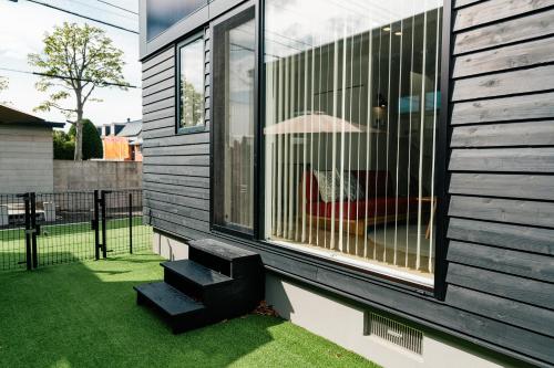 a house with a window on the side of it at 藤乃宿 ペットと暮らすように泊まる宿 in Sapporo