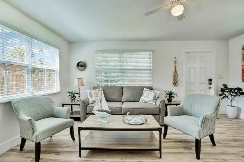 a living room with a couch and two chairs and a table at Beach Escape One Block from the Beach in Pompano Beach