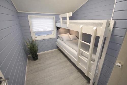 Giường trong phòng chung tại Etne Hytter