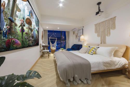a bedroom with a bed and a painting on the wall at Macaron in Zhangjiajie