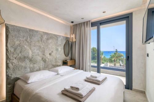 En eller flere senge i et værelse på Villa Virginia