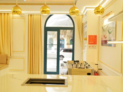 a room with a counter and a large window at PKseahome 3 bedroom 4 toilet Novaworld in Phan Thiet