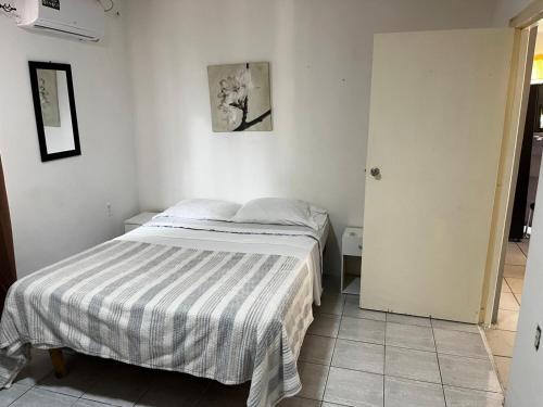 Postel nebo postele na pokoji v ubytování The Breeze Villa