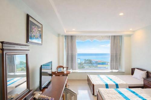 En eller flere senge i et værelse på Khu Nghỉ Dưỡng Đoàn 298 Khu 7 Tầng