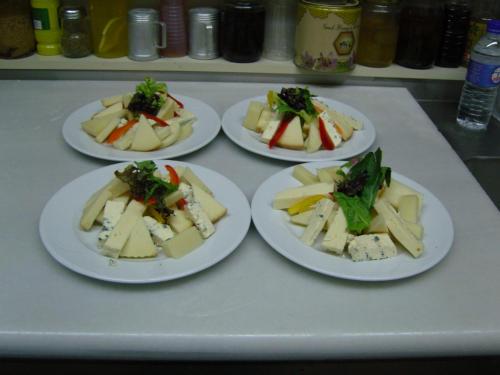 a group of four plates of food on a table at Oihalia Guesthouse in Fidhákia