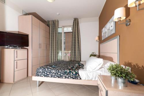 Кровать или кровати в номере Residence T2
