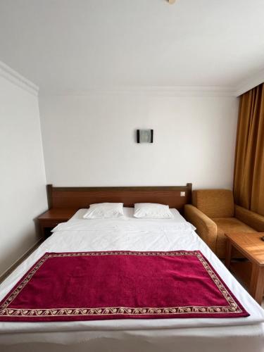 En eller flere senge i et værelse på Hotel Royal Hill