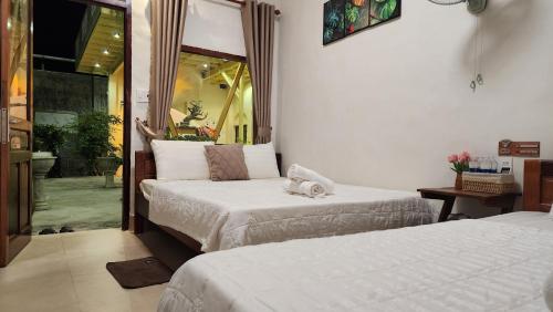 En eller flere senge i et værelse på Mộc House