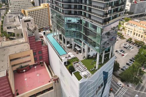 an aerial view of a building with a pool at Luxury Miami Studio 27th Floor in Miami