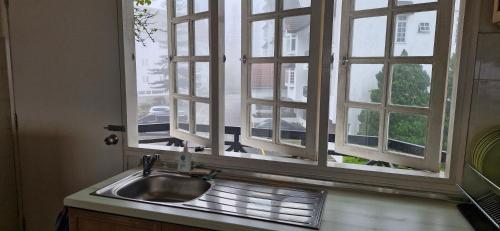 a sink in a kitchen with a window at B43A1 Silverpark 4th floor Best Mountain view in Bukit Fraser