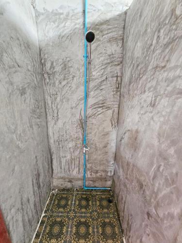 a shower with a blue pipe in a room at Top Views Retreat in Koh Rong Island