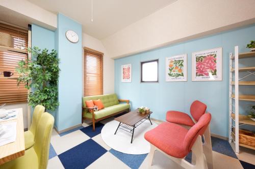 a waiting room with chairs and a table at AO301 - Tokyo Stay Spacious Apartment Direct Train to Narita & Asakusa in Tokyo