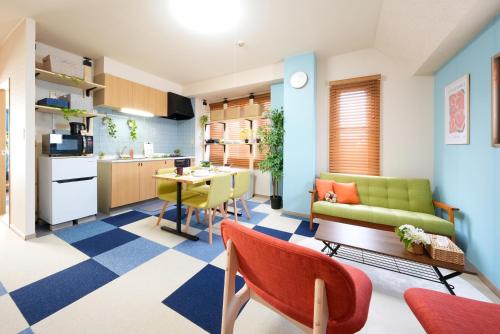 a living room with a kitchen and a dining room at AO301 - Tokyo Stay Spacious Apartment Direct Train to Narita & Asakusa in Tokyo