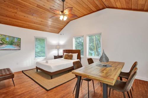 a bedroom with a bed and a wooden ceiling at Tropical Oasis Studio w Pool in Fort Lauderdale