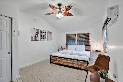 a bedroom with a bed with a butterfly on the ceiling at Tropical Oasis Studio w Pool in Fort Lauderdale