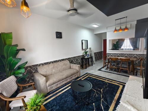 a living room with a couch and a table at Cocasa Homestay 1 in Kuala Terengganu