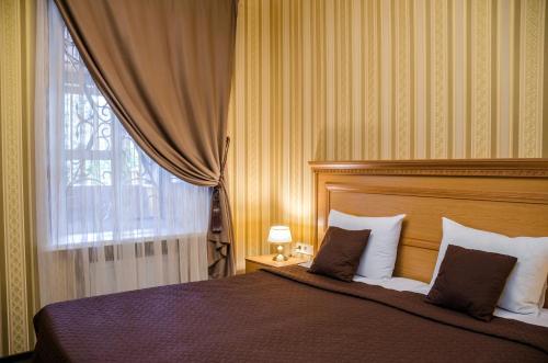 Postel nebo postele na pokoji v ubytování Dvoryanskiy Hotel
