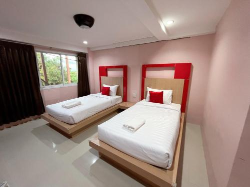 En eller flere senge i et værelse på Krabi Serene Loft