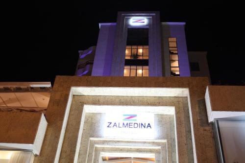 a building with a clock on the front of it at Zalmedina Hotel in Cartagena de Indias