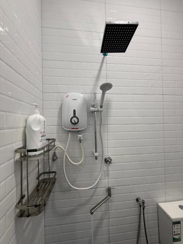 a bathroom with a shower with a hair dryer at Villa Family - Private Pool - ATV in Bachok