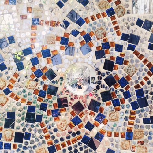 a close up of a mosaic tile floor at Inn Seventh Heaven in Pushkar